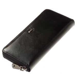 Körbe cipzáros elegáns kivitelű minőségi bőrből készül ez a nagy méretű női bőr pénztárca fekete színben. Fém kellékei elegáns sötét színűek.